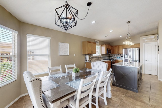 2704 Ghost Ranch St SW, Albuquerque, NM 87121 - dining room featuring a chandelier, healthy amount of natural light, light tile patterned flooring, recessed lighting, and lofted ceiling