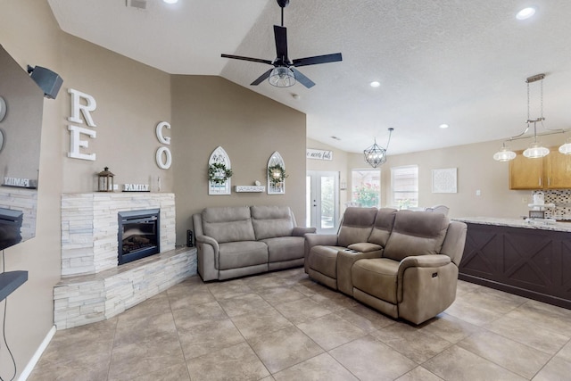2704 Ghost Ranch St SW, Albuquerque, NM 87121 - living room featuring a ceiling fan, vaulted ceiling, recessed lighting, a stone fireplace, and light tile patterned floors