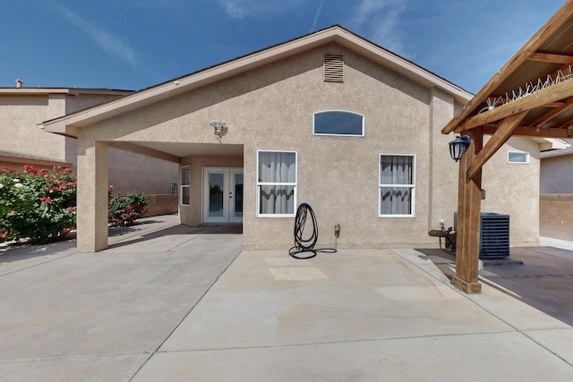 2704 Ghost Ranch St SW, Albuquerque, NM 87121 - rear view of house featuring stucco siding, french doors, and a patio area