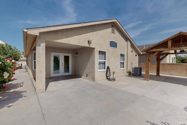 2704 Ghost Ranch St SW, Albuquerque, NM 87121 - rear view of house with stucco siding and a patio area