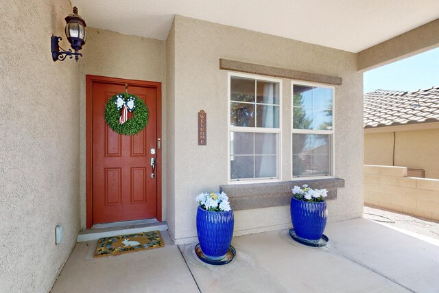 613 Loma Linda Loop NE, Rio Rancho, NM 87124 - doorway to property with stucco siding