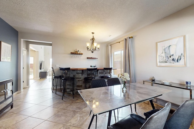 613 Loma Linda Loop NE, Rio Rancho, NM 87124 - dining space with a chandelier, a textured ceiling, light tile patterned floors, and bar