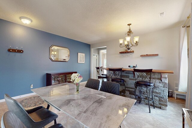 613 Loma Linda Loop NE, Rio Rancho, NM 87124 - dining space featuring a chandelier and a textured ceiling