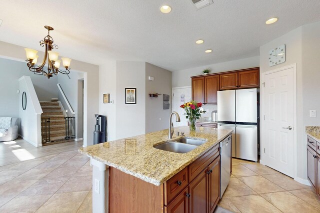 613 Loma Linda Loop NE, Rio Rancho, NM 87124 - kitchen with appliances with stainless steel finishes, recessed lighting, pendant lighting, light stone countertops, and light tile patterned floors