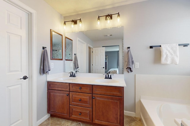 613 Loma Linda Loop NE, Rio Rancho, NM 87124 - full bathroom featuring a bath, double vanity, and tile patterned floors