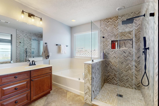 613 Loma Linda Loop NE, Rio Rancho, NM 87124 - bathroom with vanity, a bath, tiled shower, a textured ceiling, and tile patterned flooring
