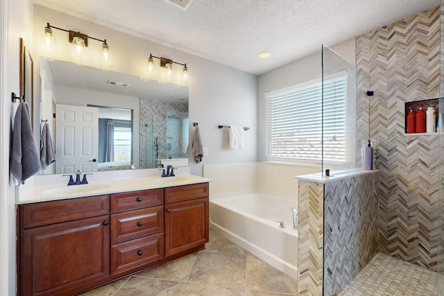 613 Loma Linda Loop NE, Rio Rancho, NM 87124 - bathroom with healthy amount of natural light, a garden tub, tiled shower, double vanity, and a textured ceiling