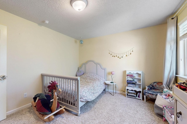 613 Loma Linda Loop NE, Rio Rancho, NM 87124 - carpeted bedroom with baseboards and a textured ceiling