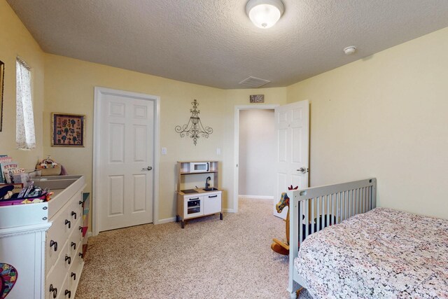 613 Loma Linda Loop NE, Rio Rancho, NM 87124 - bedroom with a textured ceiling and light colored carpet