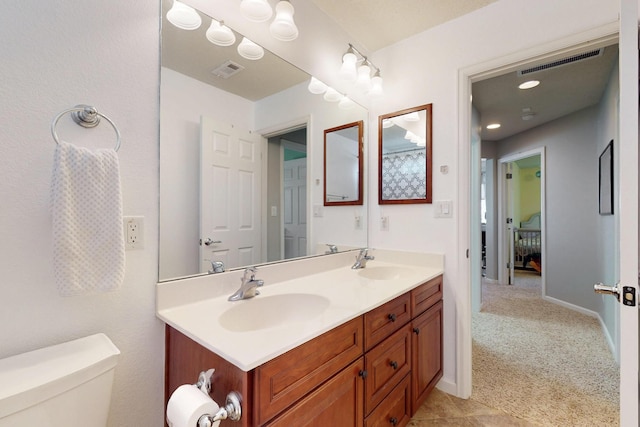 613 Loma Linda Loop NE, Rio Rancho, NM 87124 - bathroom with double vanity and toilet