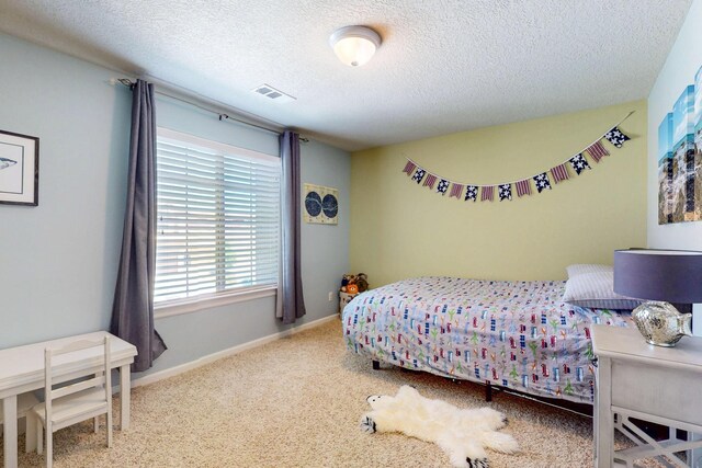 613 Loma Linda Loop NE, Rio Rancho, NM 87124 - carpeted bedroom with a textured ceiling and baseboards