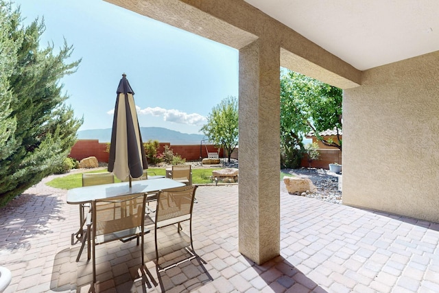 613 Loma Linda Loop NE, Rio Rancho, NM 87124 - fenced backyard with outdoor dining space and a patio