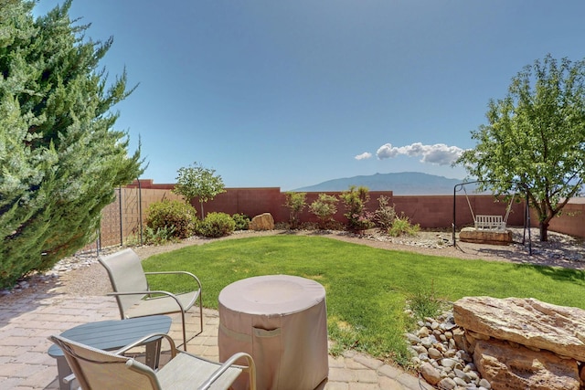 613 Loma Linda Loop NE, Rio Rancho, NM 87124 - fenced backyard featuring a patio and a mountain view