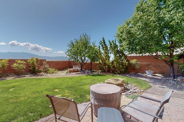 613 Loma Linda Loop NE, Rio Rancho, NM 87124 - fenced backyard featuring a mountain view and a patio area