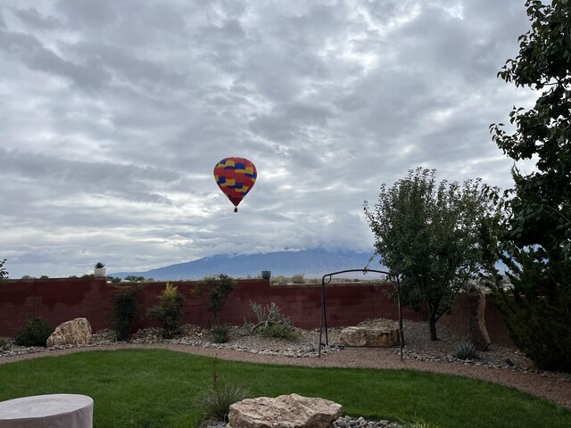 613 Loma Linda Loop NE, Rio Rancho, NM 87124 - fenced backyard featuring a mountain view