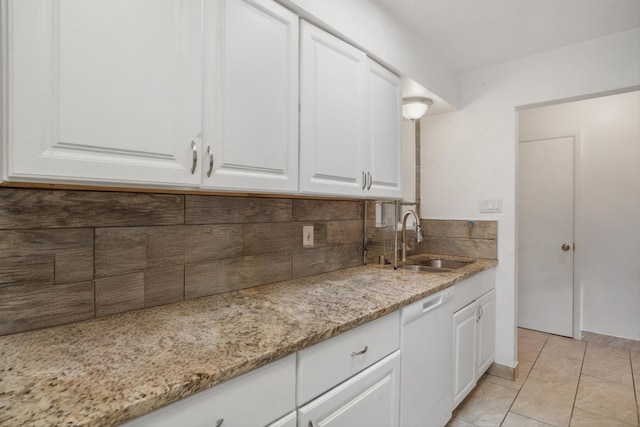 9200 Lagrima De Oro Rd NE, Albuquerque, NM 87111 - kitchen with dishwasher, backsplash, white cabinets, and light stone countertops