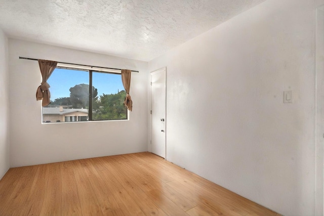 9200 Lagrima De Oro Rd NE, Albuquerque, NM 87111 - unfurnished room featuring wood-type flooring and a textured ceiling