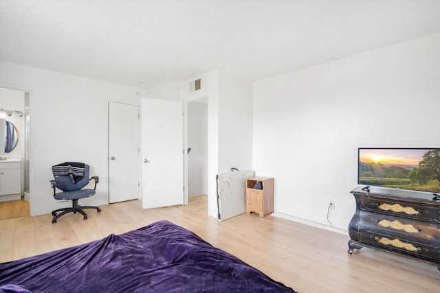9200 Lagrima De Oro Rd NE, Albuquerque, NM 87111 - bedroom with wood finished floors and ensuite bathroom