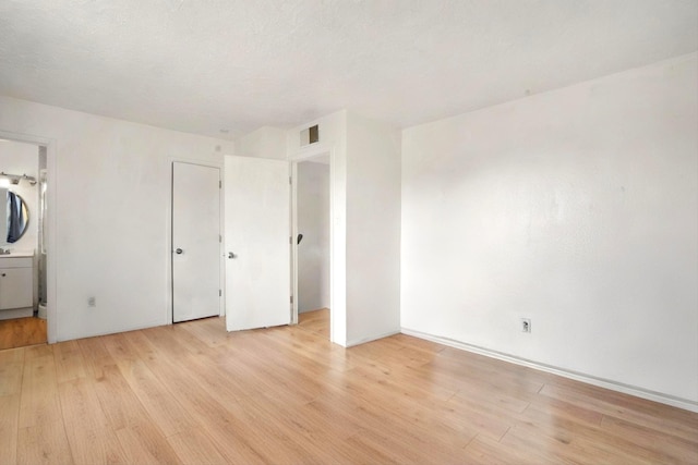 9200 Lagrima De Oro Rd NE, Albuquerque, NM 87111 - unfurnished bedroom with light wood-type flooring and ensuite bath