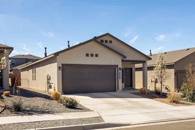 4880 Blackburn Rd, Rio Rancho, NM 87144 - ranch-style house with an attached garage, driveway, and stucco siding