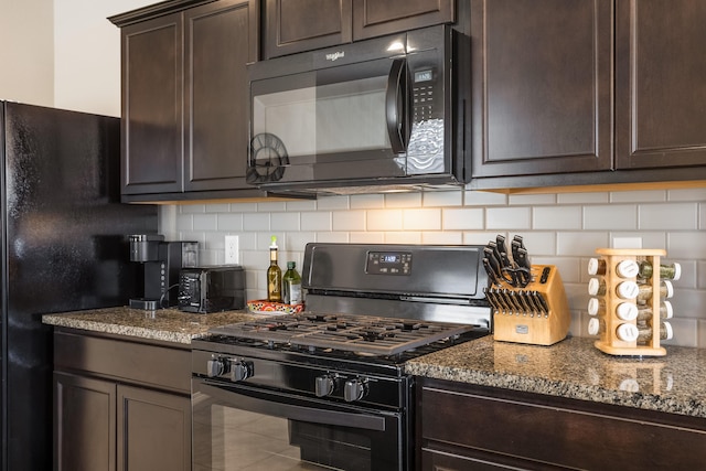 4880 Blackburn Rd, Rio Rancho, NM 87144 - kitchen with black appliances, dark brown cabinetry, stone countertops, and tasteful backsplash
