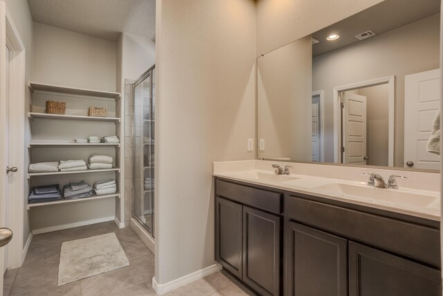 4880 Blackburn Rd, Rio Rancho, NM 87144 - full bath with double vanity, tile patterned floors, and a shower stall