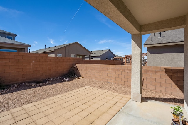 4880 Blackburn Rd, Rio Rancho, NM 87144 - fenced backyard with a patio area