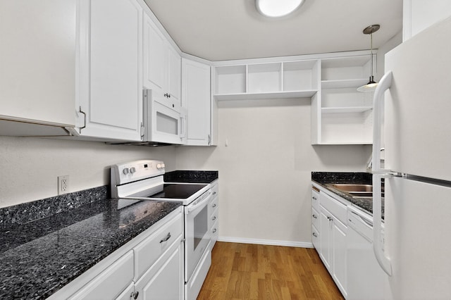 1821 Dartmouth Dr NE Unit 104, Albuquerque, NM 87106 - kitchen with white appliances, open shelves, white cabinetry, and light wood-style flooring