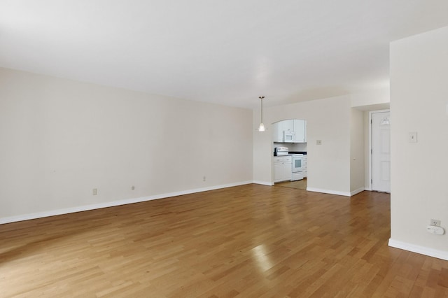 1821 Dartmouth Dr NE Unit 104, Albuquerque, NM 87106 - unfurnished living room with light wood-style flooring