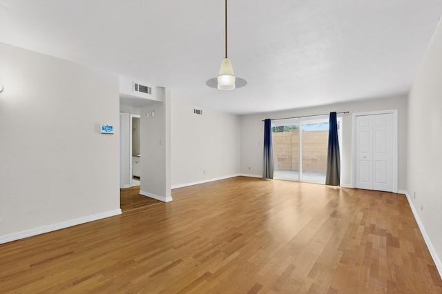 1821 Dartmouth Dr NE Unit 104, Albuquerque, NM 87106 - unfurnished room featuring light wood-style floors and baseboards