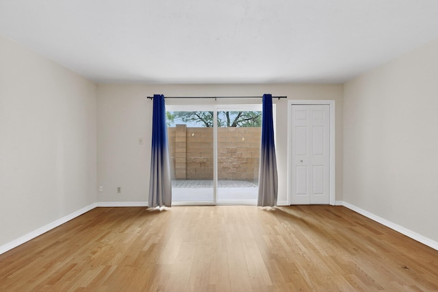 1821 Dartmouth Dr NE Unit 104, Albuquerque, NM 87106 - spare room featuring wood finished floors and baseboards