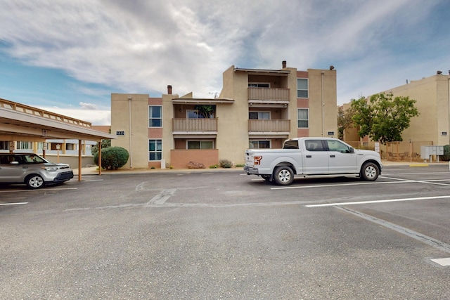 1821 Dartmouth Dr NE Unit 104, Albuquerque, NM 87106 - view of property featuring uncovered parking