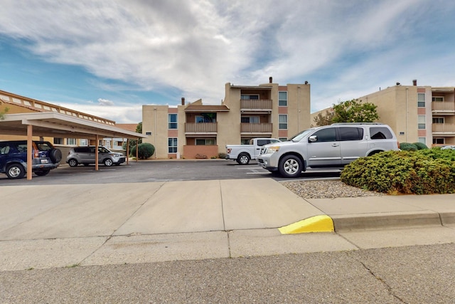 1821 Dartmouth Dr NE Unit 104, Albuquerque, NM 87106 - view of partially covered parking lot