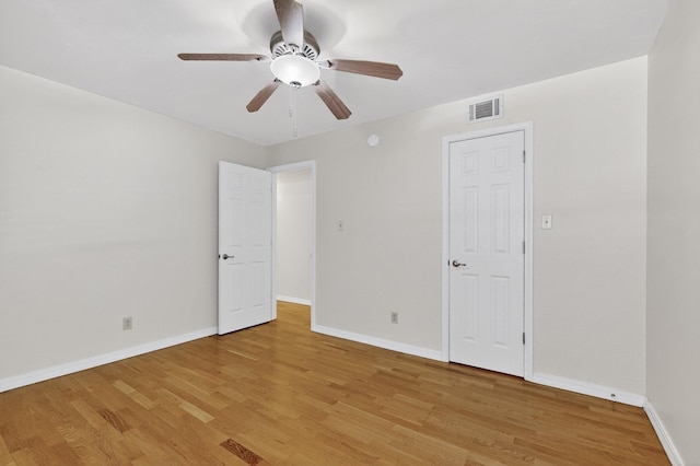 1821 Dartmouth Dr NE Unit 104, Albuquerque, NM 87106 - unfurnished bedroom featuring light wood-style flooring and ceiling fan