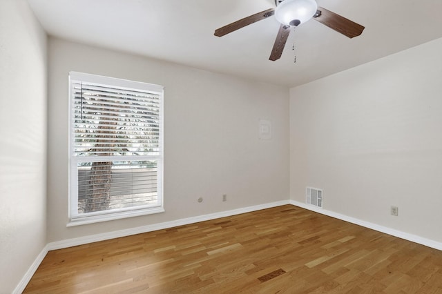 1821 Dartmouth Dr NE Unit 104, Albuquerque, NM 87106 - unfurnished room featuring light wood-style floors and ceiling fan