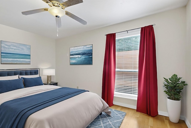 1821 Dartmouth Dr NE Unit 104, Albuquerque, NM 87106 - bedroom with wood finished floors and a ceiling fan