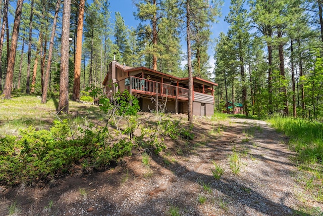 578 Horseshoe Loop, Jemez Springs, NM 87025 - back of house featuring a deck and a forest view