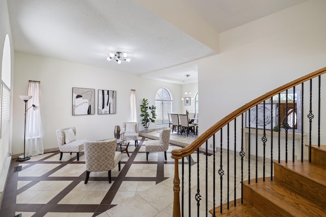 8712 Greenarbor Rd NE, Albuquerque, NM 87122 - living room with light tile patterned floors, stairs, and inlaid floor details