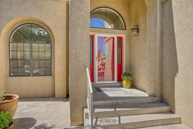 8712 Greenarbor Rd NE, Albuquerque, NM 87122 - doorway to property with stucco siding