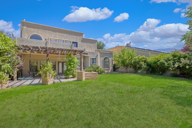 8712 Greenarbor Rd NE, Albuquerque, NM 87122 - rear view of property with a pergola, a patio, a yard, and stucco siding