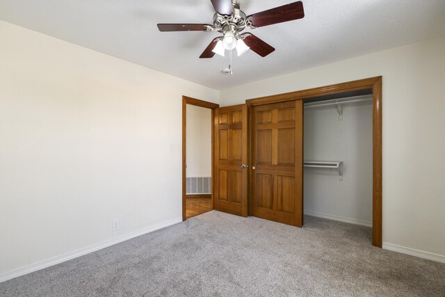 8712 Greenarbor Rd NE, Albuquerque, NM 87122 - unfurnished bedroom featuring carpet flooring, a closet, and ceiling fan