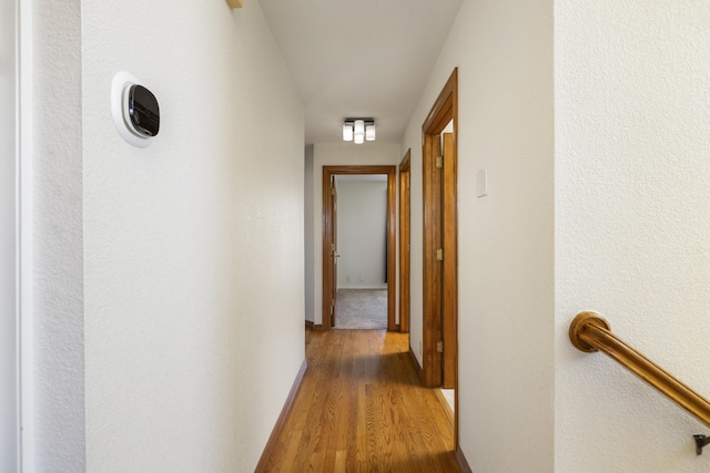 8712 Greenarbor Rd NE, Albuquerque, NM 87122 - corridor featuring wood finished floors and baseboards