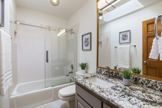 8712 Greenarbor Rd NE, Albuquerque, NM 87122 - full bath with vanity, bath / shower combo with glass door, and a skylight