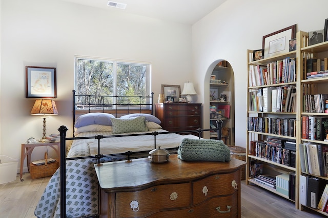 120 Espinosa Rd, Corrales, NM 87048 - bedroom with wood finished floors and arched walkways