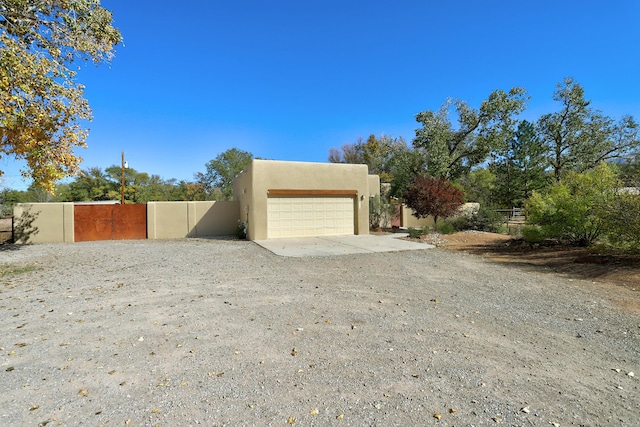 120 Espinosa Rd, Corrales, NM 87048 - garage featuring driveway