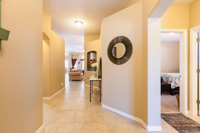 4601 Mi Cordelia Dr NW, Albuquerque, NM 87120 - corridor featuring light tile patterned flooring and baseboards