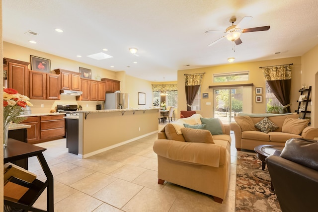 4601 Mi Cordelia Dr NW, Albuquerque, NM 87120 - living area featuring a ceiling fan, light tile patterned floors, and recessed lighting