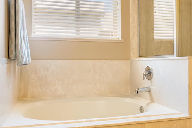 4601 Mi Cordelia Dr NW, Albuquerque, NM 87120 - bathroom with healthy amount of natural light and a bath