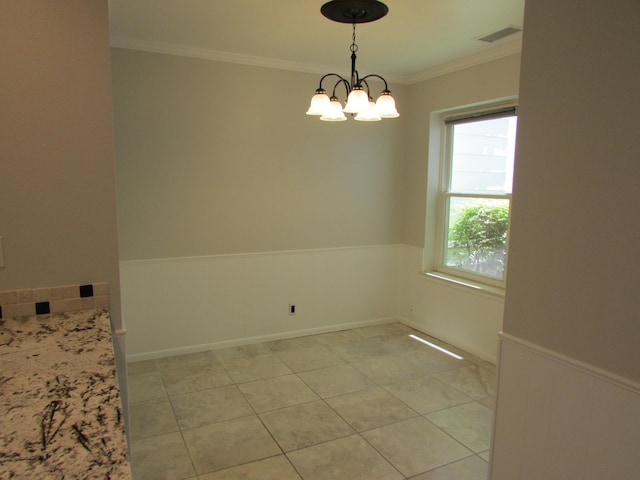 3109 Dallas St NE, Albuquerque, NM 87110 - spare room with wainscoting, a chandelier, ornamental molding, and light tile patterned floors