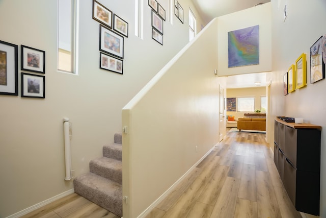 4381 Lauren Loop NE, Rio Rancho, NM 87124 - stairs with a towering ceiling and wood finished floors